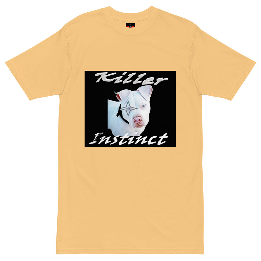 Beige t-shirt with graphic of white dog, black star over eye, and text Killer Instinct