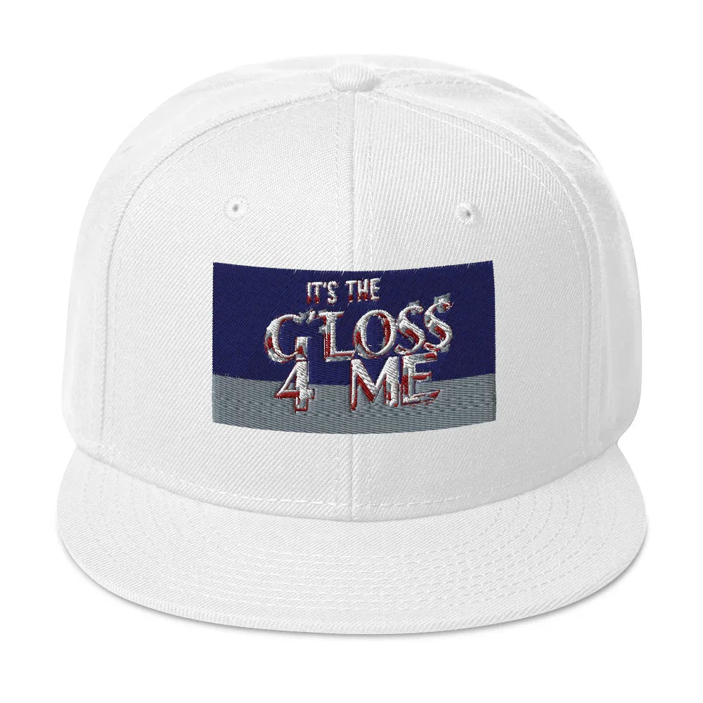 White snapback hat with bold embroidered text 'IT'S THE GLOSS 4 ME' on the front panel